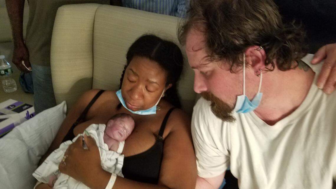 In this provided photo, Alana Ross and Daniel McCarthy hold their baby, Everleigh, who was born on July 25, 2020.