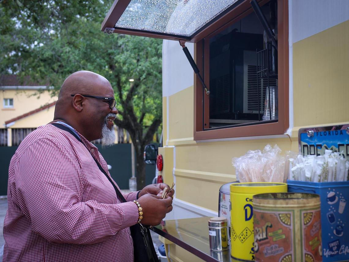 Michael Anderson picks up his order at Ophelia during a quick break from office work.