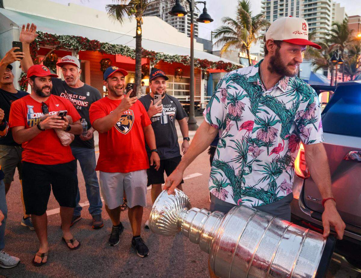 Panthers Captain Aleksander Barkov exits a SUV with the Stanley Cup outside the Elbo Room in Fort Lauderdale before sunrise the day after the Florida Panthers won the Stanley Cup Final for the second time on Wednesday, June 18, 2025.