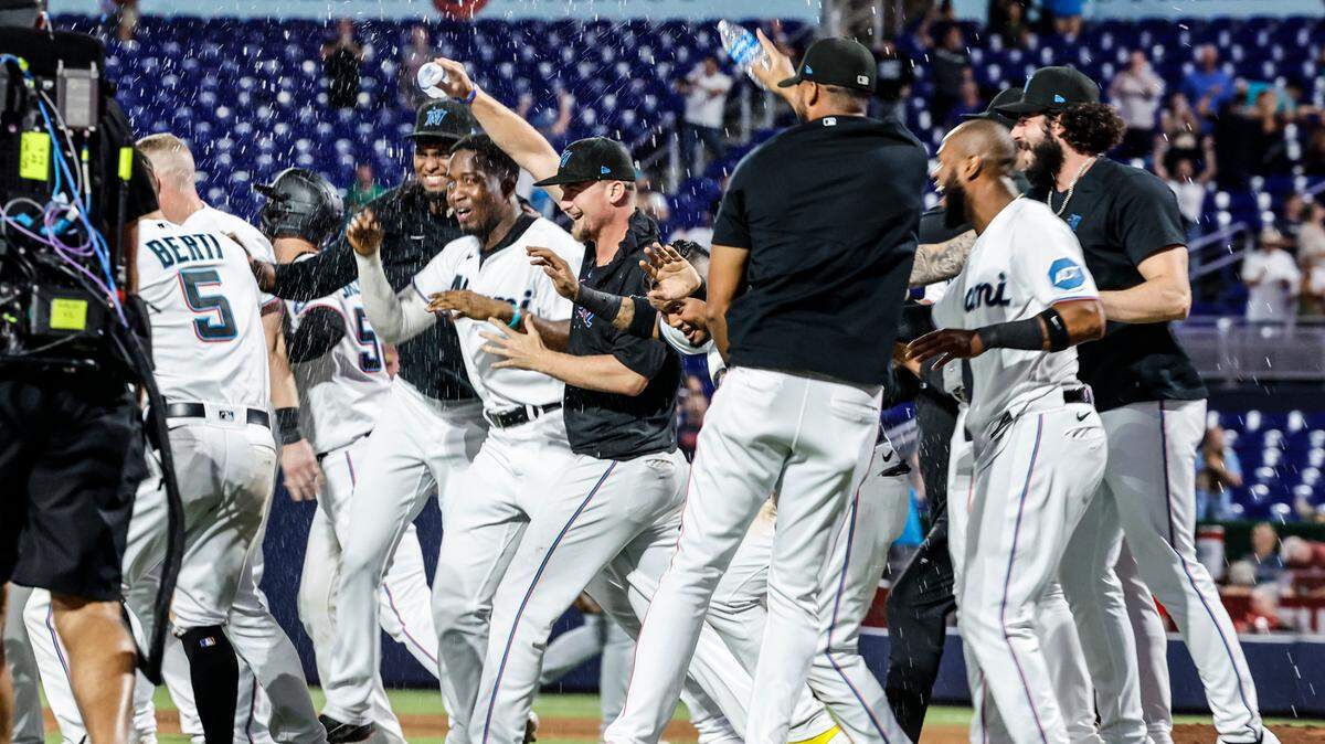 Miami Marlins celebrate on the infield after defeating the St. Louis Cardinals at loanDepot park in Miami on Wednesday, July 5, 2023.
