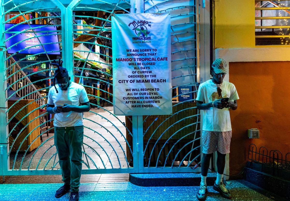 A sign explaining the closure of Mango’s Tropical Cafe during all days that the curfew has been ordered by Miami Beach, on Friday, March 15, 2024.