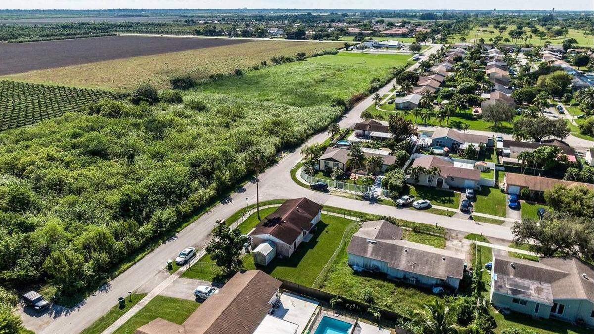 A neighborhood next to fields in South Miami-Dade that are included in a plan to convert farmland into an industrial park near Homestead.