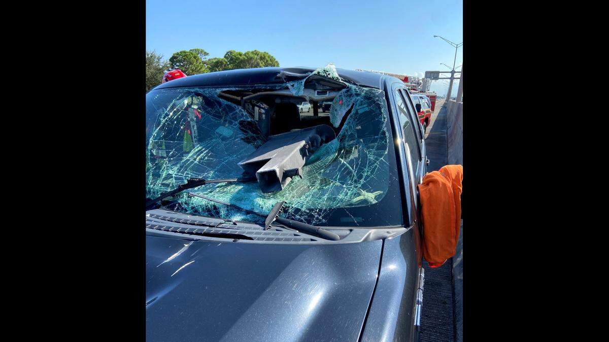 A piece of metal went through the windshield of a Ford on Interstate 95 Tuesday.