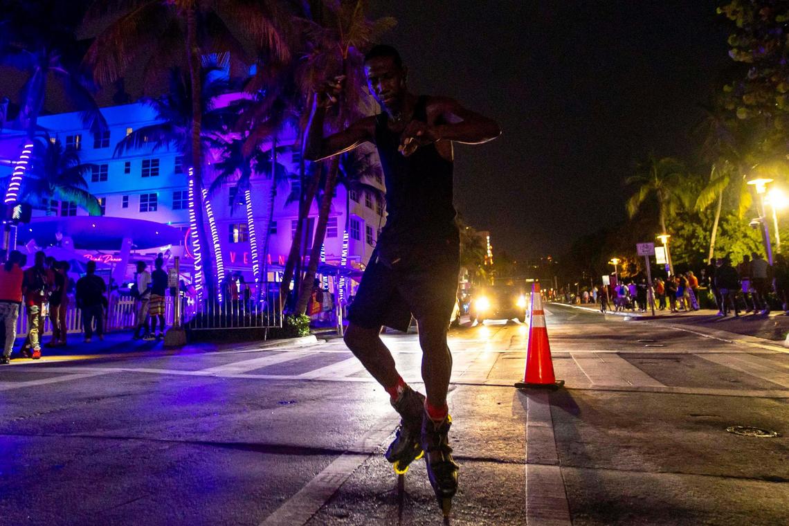 Roller skater and North Miami resident, Shabazz Harris, 49, dances to his own music in the middle of Ocean Drive and 10th Street during the second day of Memorial Day Weekend in Miami Beach, Florida, on Saturday, May 28, 2022.