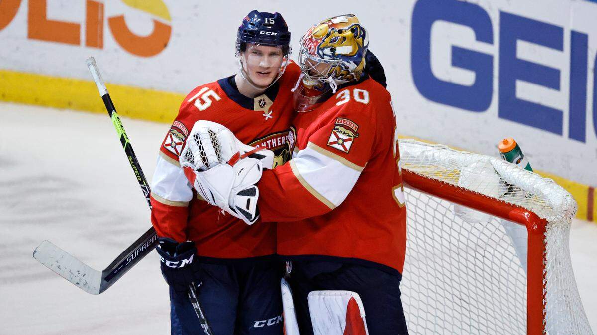 Florida Panthers players Anton Lundell (15) and Spencer Knight (30) celebrate their 4-1 win over the Vegas Golden Knights during an NHL game at the FLA Live Arena on Thursday, January 27, 2022 in Sunrise, Fl.