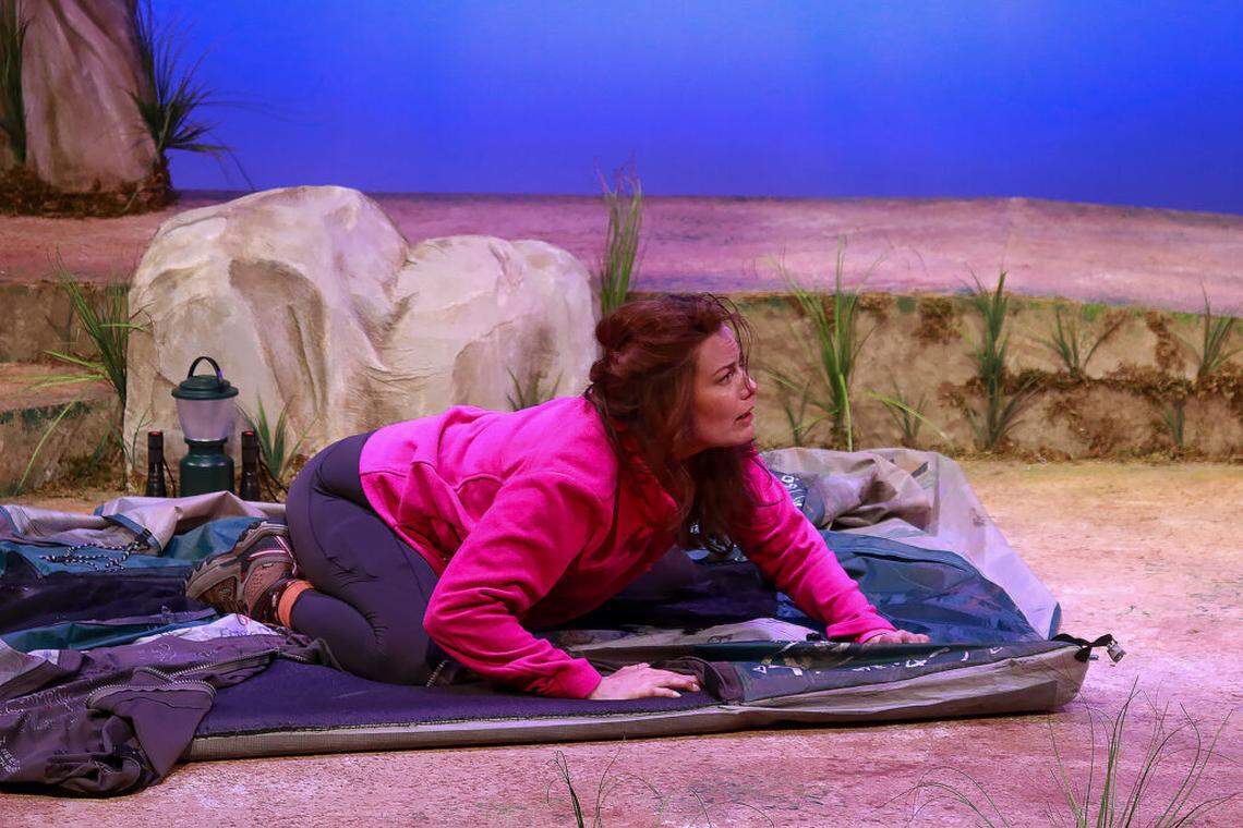 Anna Lise Jensen as Monica has a meltdown on top of a camping tent she’s had since college in a scene from “Step By Step” at Actors’ Playhouse, at the Miracle Theatre through Sunday, Aug. 10.