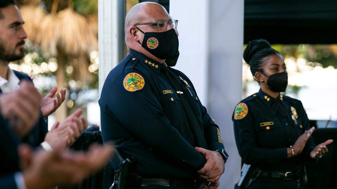 Interim Miami Police Chief Manny Morales listens as Miami Mayor Francis Suarez speaks after being inaugurated as the 80th President of the U.S. Conference of Mayors at the Maurice A. Ferré Park in downtown Miami, Florida on Monday, January 3, 2022. The conference brings together municipal leaders from across the country to discuss issues facing local governments.