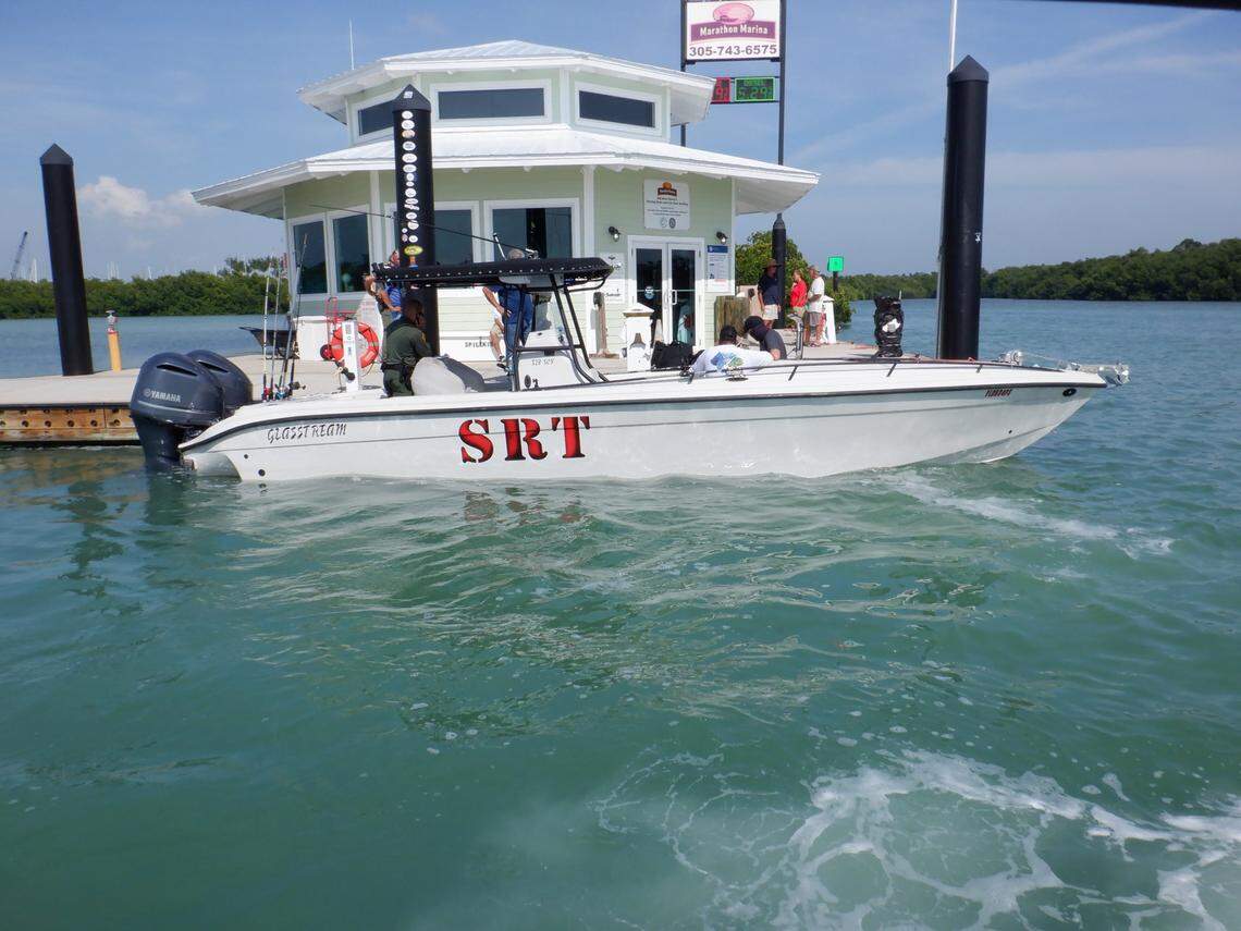 A 32-foot boat is docked in Boot Key Harbor in the Florida Keys Thursday, April 7, 2022. Florida Fish and Wildlife Conservation Commission officers said they found it overloaded with drums of fuel and items consistent with smuggling.