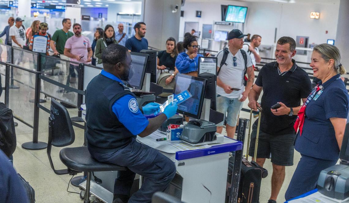 TSA agents verify identities at Miami International Airport on Wednesday, May 7, 2025.