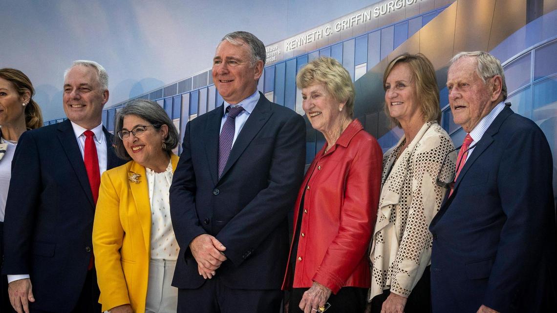 Miami, FL- January 31, 2023 - Local dignitaries posing for photos in front of a rendering of the new Kenneth C. Griffin Surgical Tower. Griffin, Citadel’s CEO, (center) donated $25 million to Nicklaus Children’s to support the new five-story, 127,000-square-foot surgical tower opening in 2024.