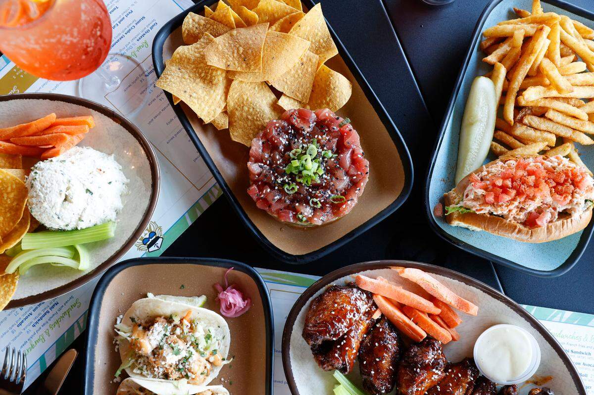 The menu at Oceanside Safari includes fish tacos, fish dip, tuna tartare and more.