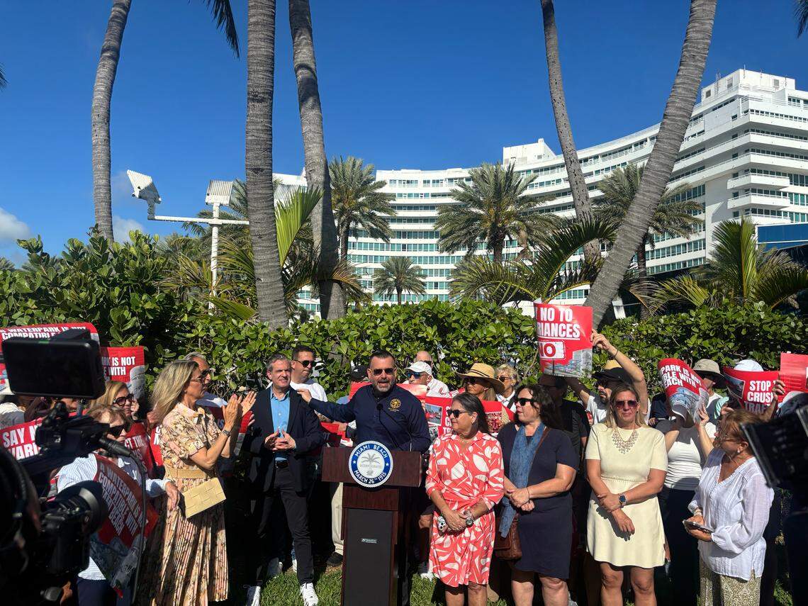 Miami Beach Commissioner Alex Fernandez (center) acknowledges Mayor Steven Meiner during a press conference to oppose state legislation alongside other city officials and residents in front of the Fontainebleau Hotel on Tuesday.