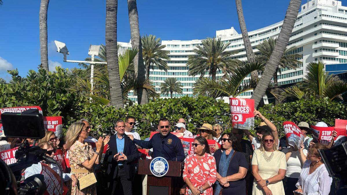 Miami Beach Commissioner Alex Fernandez (center) with Mayor Steven Meiner during a press conference to oppose state legislation alongside other city officials and residents in front of the Fontainebleau Hotel on March 10, 2026.