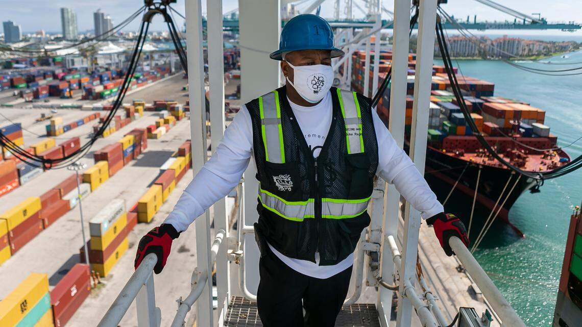 John Ragin, 56, works to offload containers from a cargo ship at PortMiami on Saturday, February 20, 2021. Ragin, a header, has been working as a longshoreman for 27 years.