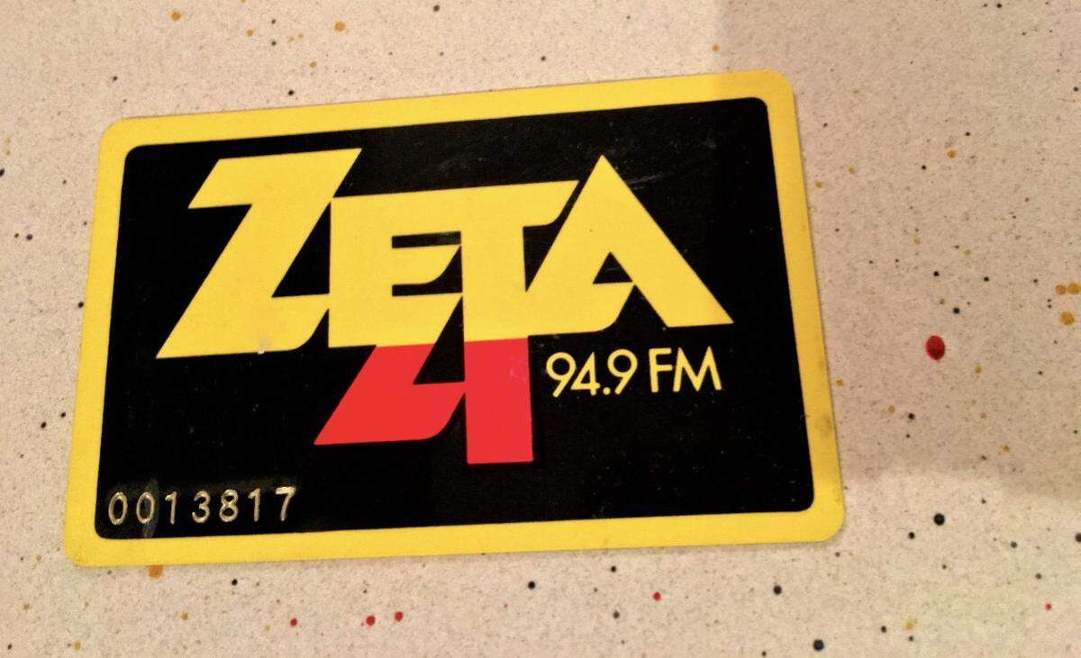 A Zeta 4 94.9 FM discount card from 1979 sitting atop Fleetwood Mac’s “Tusk” album jacket.