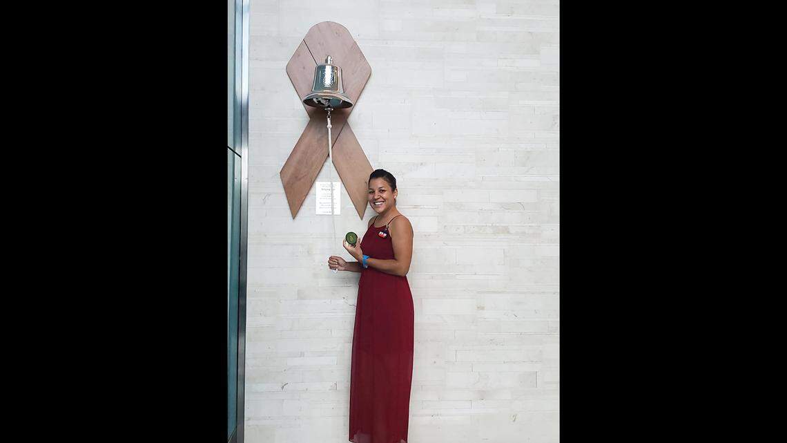 Stephany Goyla rings the cancer bell at Miami Cancer Institute to celebrate being cancer free