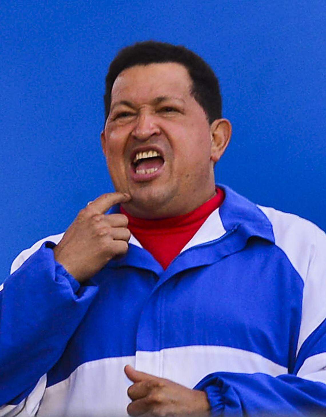 Venezuelan President Hugo Chavez gestures during a campaign rally for his reelection in Valencia, Carabobo state, Venezuela on October 3, 2012.