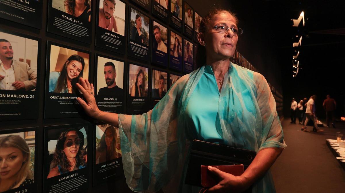 Hannie Ricardo, 59, touches the picture of her late daughter, Oriya Litman Ricardo, at Nova Exhibition Miami at Greenwich Studios in North Miami. The Nova Exhibition is a walk-through experience honoring the victims and survivors of the Hamas attacks on October 7, 2023