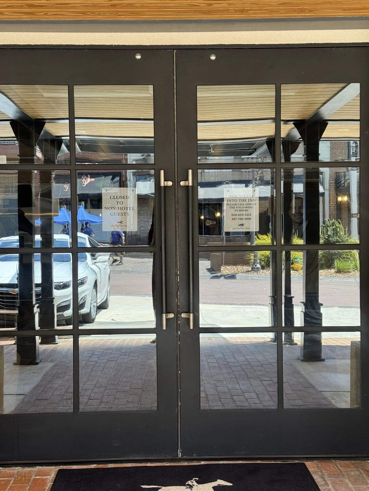 A sign at the front door of the Governor’s Inn says the building is “closed to non-hotel guests.”