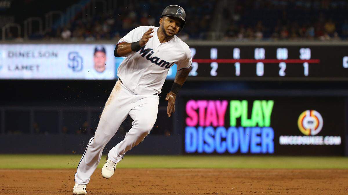 Miami Marlins center fielder Cesar Puello (46) rounds third base as he scores on a RBI double bythird baseman Neil Walker (18) during the second inning of an Major League Baseball game against the San Diego Padres at Marlins Park in Miami on Thursday, July 18, 2019.