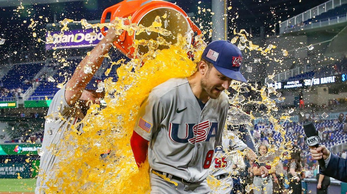 USA infielder Trea Turner (8) is dunked by teammates after the USA defeats Venezuela during the World Baseball Classic quarterfinal at loanDepot Park in Miami on Saturday, March 18, 2023.