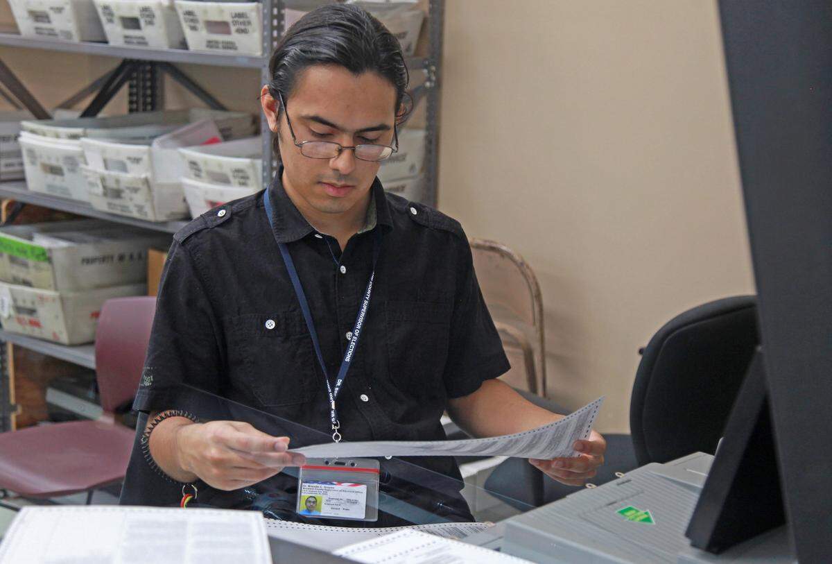 Election workers recount ballots cast during the Florida midterm elections. Broward elections officials began a recount on Tuesday, Nov. 13, 2018, at the Broward Supervisor of Elections Office in Lauderhill, Florida.