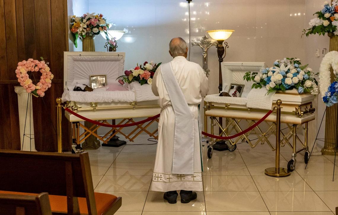 Deacon José Aleman from Blessed Trinity Parish in Miami Springs spontaneously stopped by for a short prayer at the viewing for Laura and Jeffry Belval.