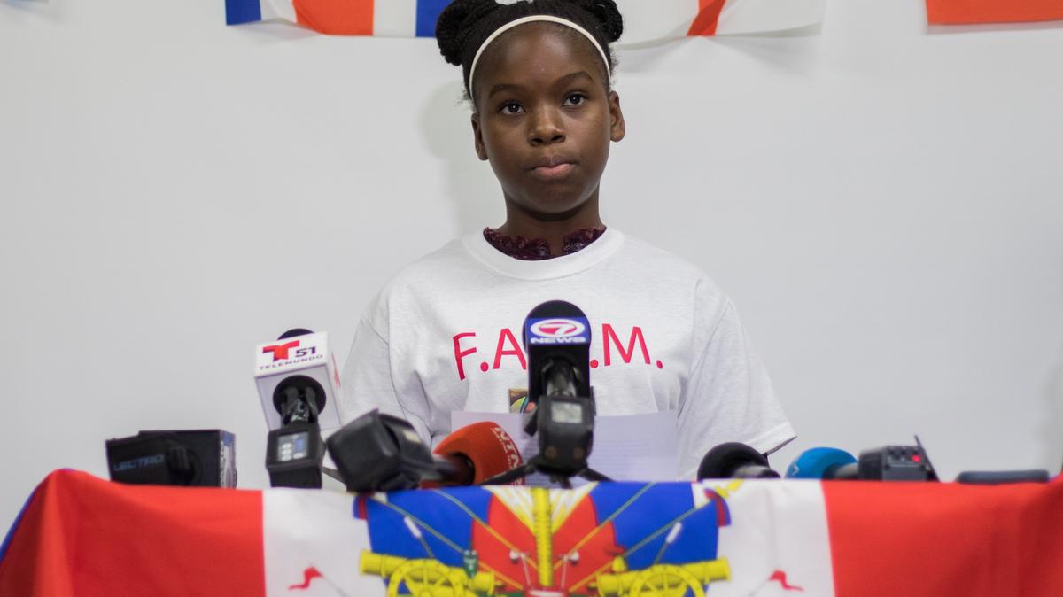 Christina Ponthieux, a daughter of TPS recipients facing possible deportation, urges President Donald Trump to find a permanent solution for TPS recipients during a press conference at Family Action Network Movement (FAMN) in Miami, Tuesday, July 24, 2018. In one year, the termination of TPS for Haitians will become effective.