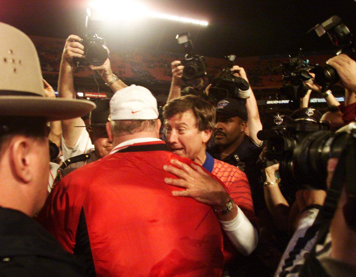 Florida coach Steve Spurrier, right, talks to Maryland coach Ralph Friedgen after the Gators won the Orange Bowl Game in 2002.
