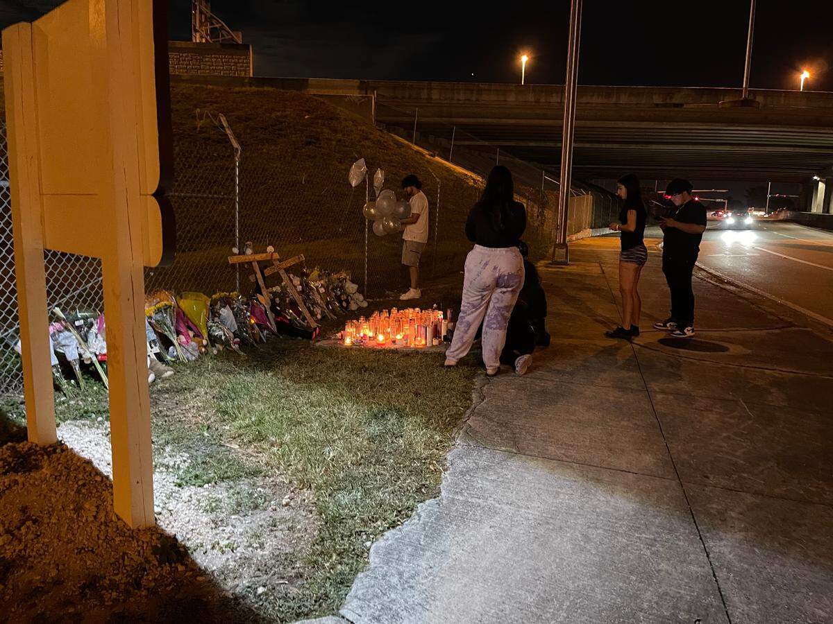 Friends of Anthony Gago and Jazmin Keltz mourn their loss at a vigil created by the site of the crash that killed them.