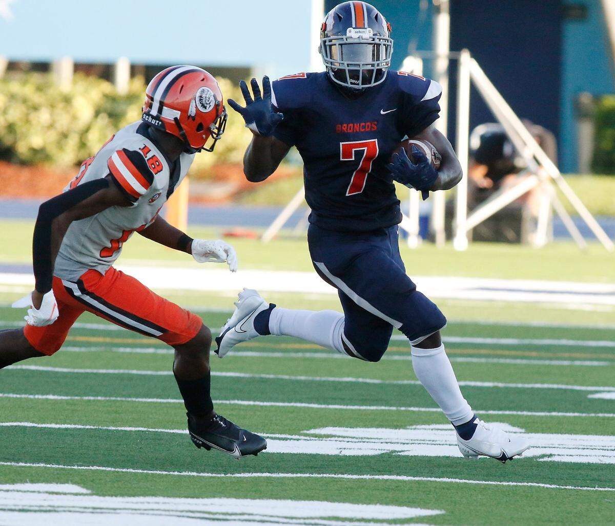 Homestead Broncos’ Issac Brown (7) carries the ball against Carol City Chiefs during a preseason football game Thursday, August 19, 2021 at Traz Powell Stadium in Miami