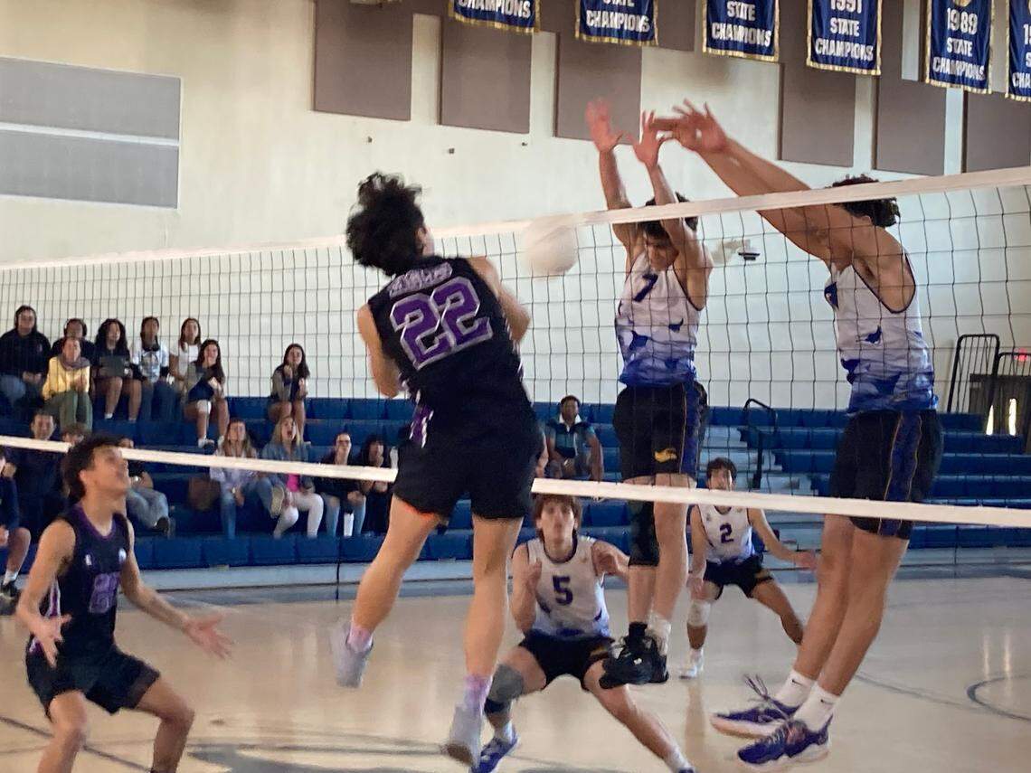 Southwest’s Juanmarco Diaz goes high up for a kill as Miami High defenders try for the block during Friday’s GMAC boys volleyball championship game at Miami High.