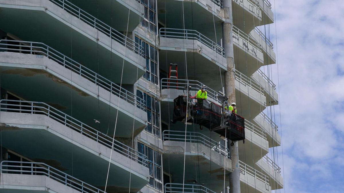 Construction employees work to renovate the Hamilton on the Bay in Miami’s increasingly popular Edgewater neighborhood.