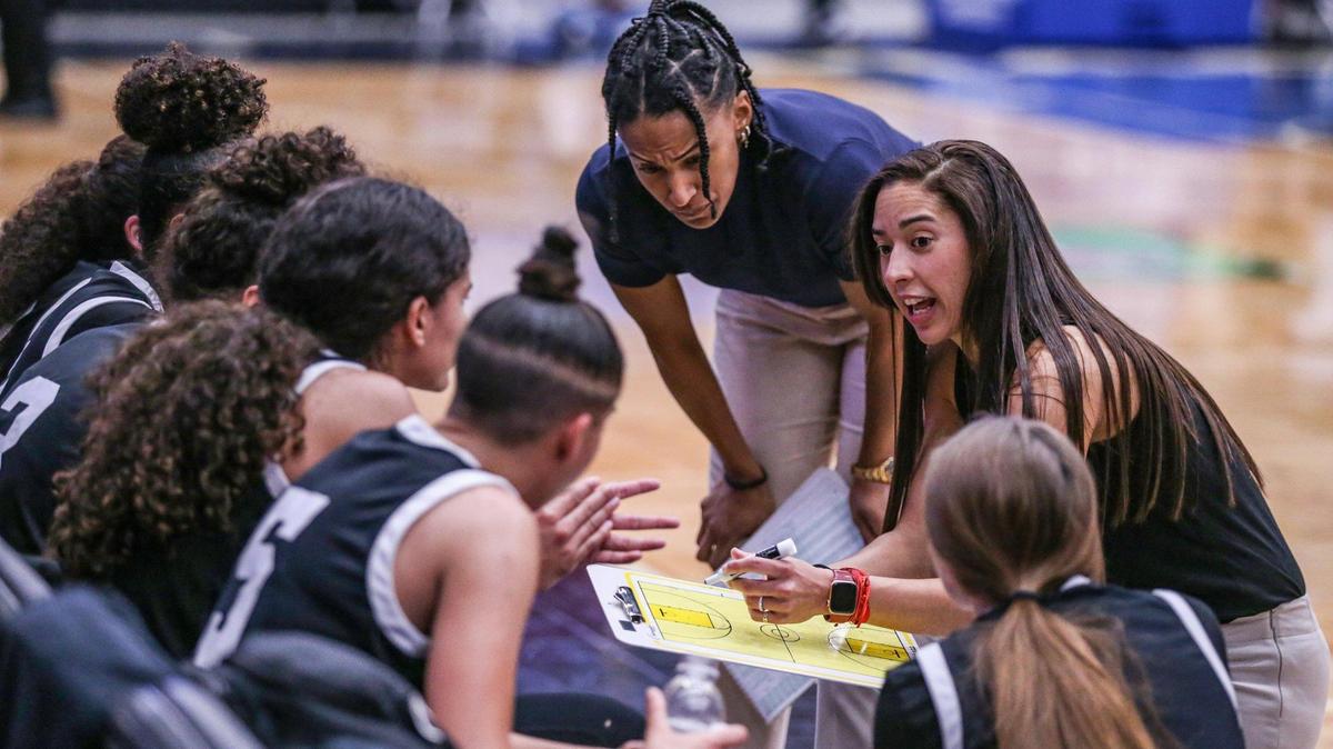Miami Christian head coach Chanel Davila talks to the team during a timeout in the game against Faith Christian in the Class 2A girls basketball state championship game at the RP Funding Center in Lakeland on Saturday, February 26, 2022.