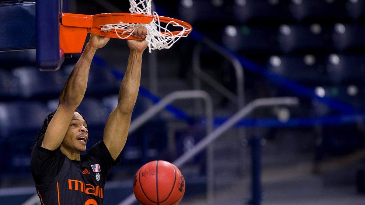Miami’s Isaiah Wong (2) dunks during the second half of an NCAA college basketball game against Notre Dame on Sunday, Feb. 14, 2021, in South Bend, Ind. Notre Dame won 71-61. (AP Photo/Robert Franklin)