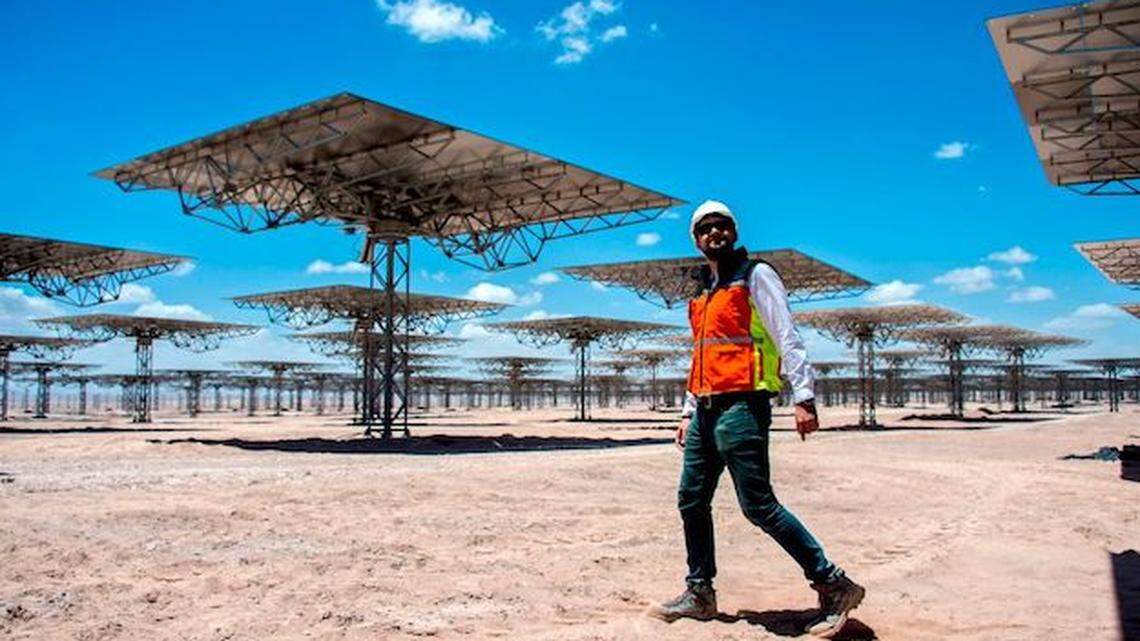 A worker walks amid solar panels in Antofagasta, Chile, the first thermosolar power plant in Latin America. Surveys find that Latin American countries lag in research and innovation.