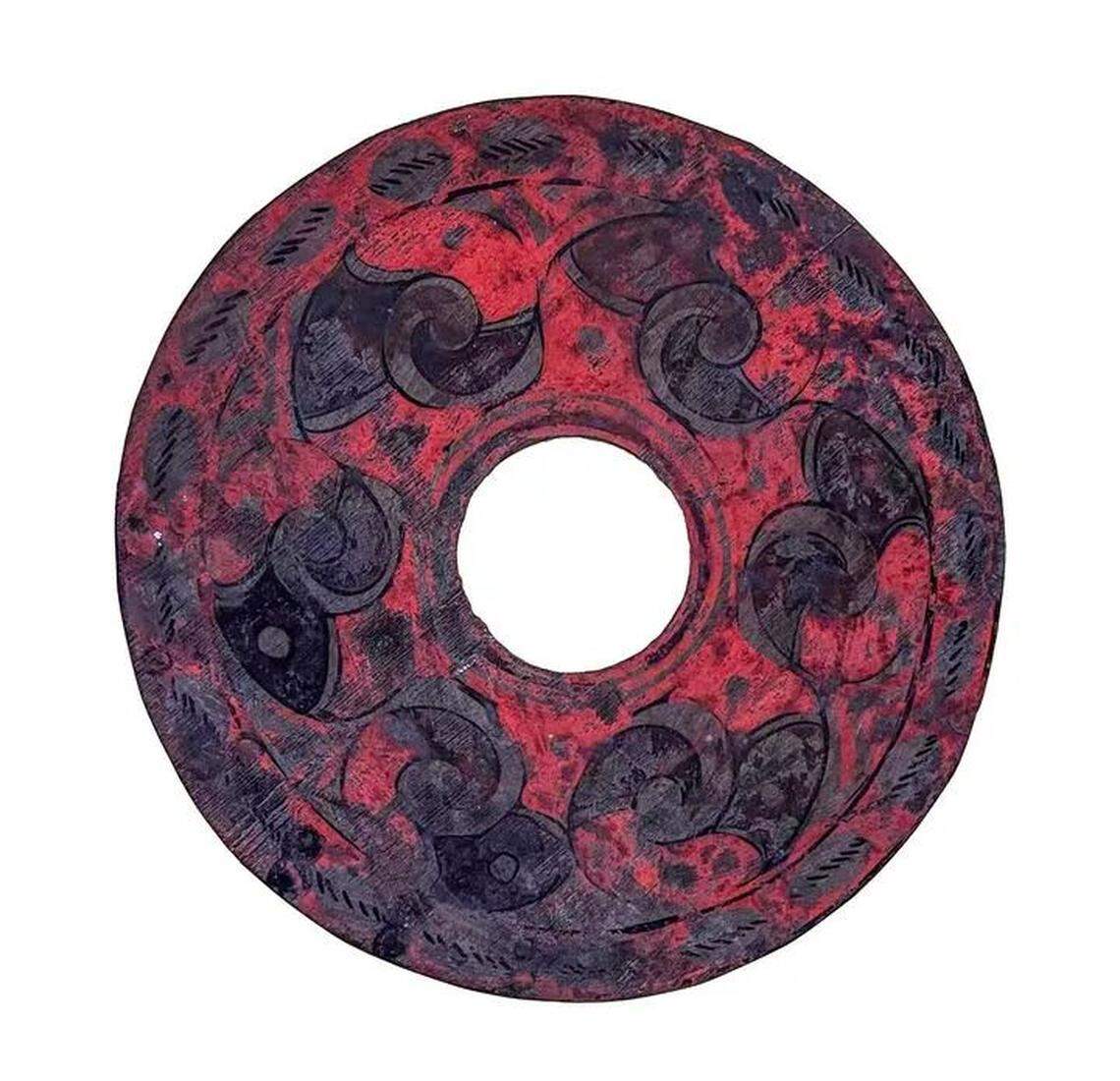 More than 600 artifacts, like this wooden piece, were excavated from the burial, officials said.