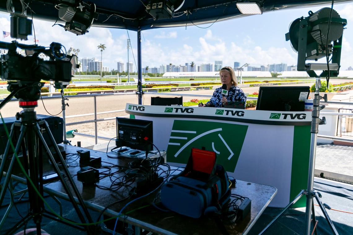 Caton Bredar, a TV horse racing analyst for TVG, broadcasts during a race at Gulfstream Park Racing and Casino in Hallandale Beach, Florida on Friday, March 13, 2020. Organizers have decided to continue racing horses but are preventing fans from attending the event due to fears of possible COVID-19 transmissions.