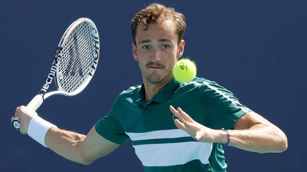 Daniil Medvedev of Russia returns to Alexei Popyrin of Australia during their match at the Miami Open tennis tournament at Hard Rock Stadium Sunday, March 28, 2021, in Miami Gardens, Fl.