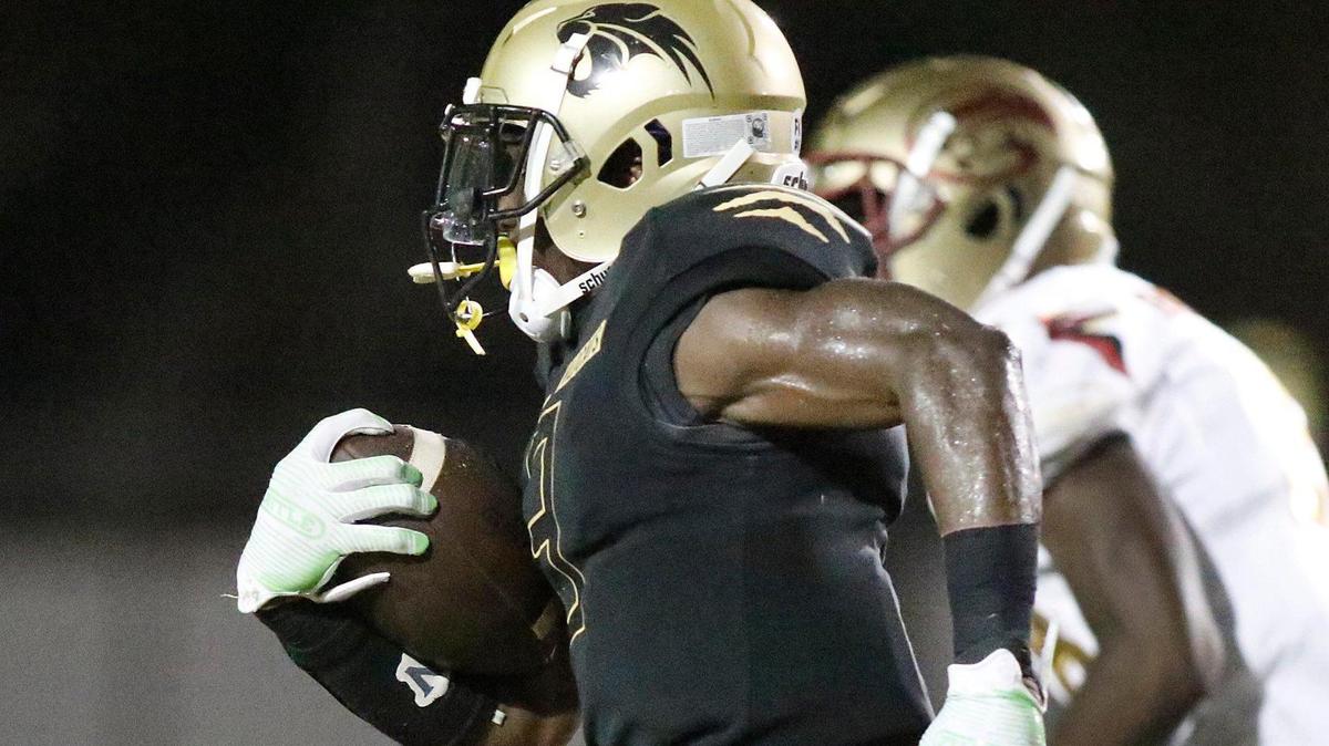 Western wide receiver TyreikT hrope (3) runs for a second Wildcats touchdown against Coconut Creek Cougars during the football game on Friday, October 8, 2021 at Western HS in Davie