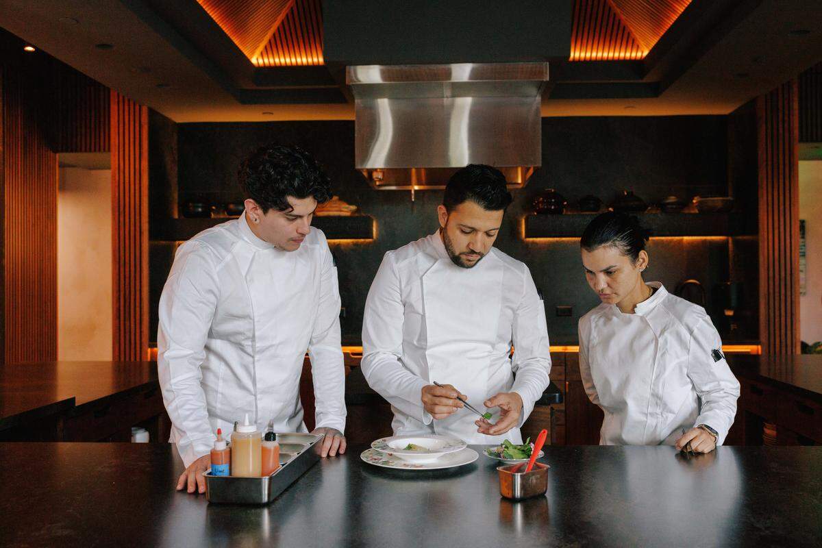 Osmel González, center, with chef de partie Alex Loyola and pastry chef Leiti Gonzalez at Emelina.