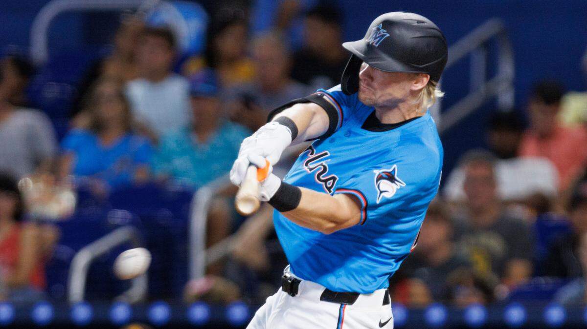 Miami Marlins outfielder Kyle Stowers (28) hits a single during the third inning of a baseball game on Sunday, Aug. 11, 2024, at loanDepot Park in Miami.