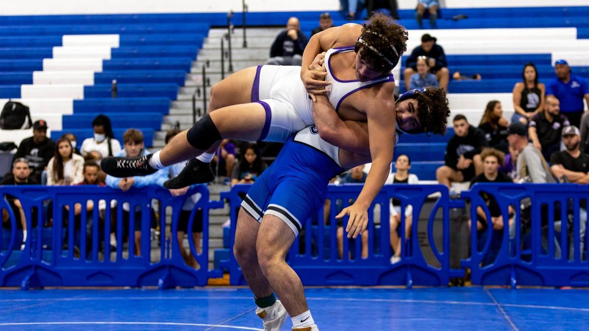 South Dade’s Sawyer Bartelt picks up Southwest Miami’s Jonathan Fraga during the 2023 Boys GMAC Wrestling 220 weight class championship finals at South Dade Senior High School in Homestead, Florida, on Saturday, February 4, 2023.