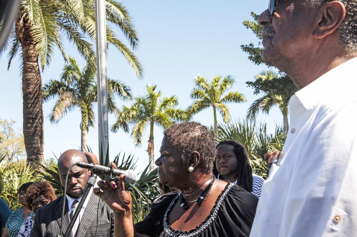 Residents from Coconut Grove speak in support of new building regulations in the area outside Miami City Hall on Thursday.