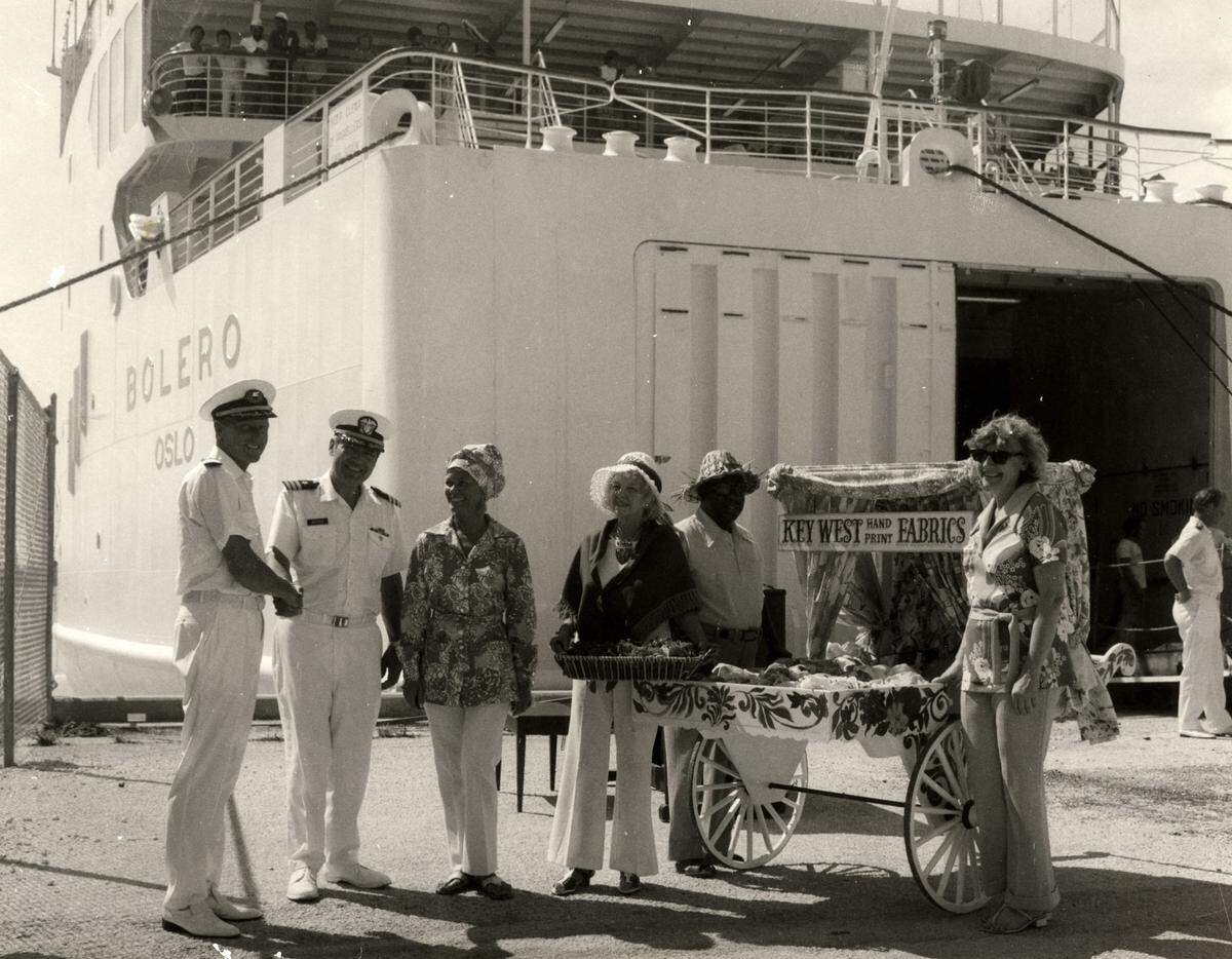 People welcome the cruise ship Bolero to the dock at Trumbo Point in Key West circa 1974. The group included the popular local musician Coffee Butler, pictured second from the right.