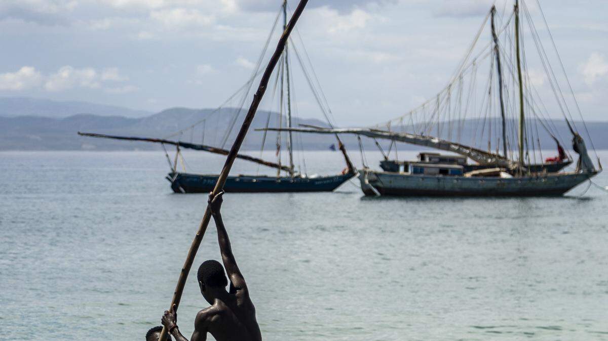 Two boys head out from the beach after dropping off passengers at the village of La Vallee on the Isle de la Tortue in Haiti’s Northwest. The poverty-stricken region is a popular jumping off point for fleeing Haitians seeking to illegally migrate to the United States and The Bahamas.
