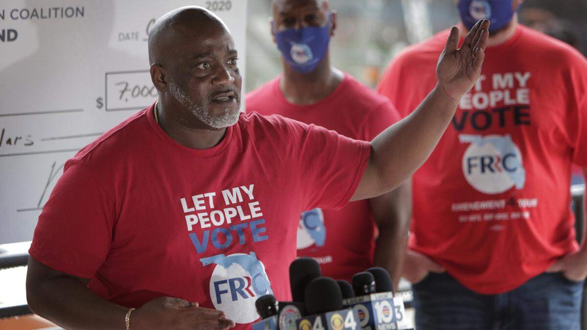 Executive director of the Florida Rights Restoration Coalition, Desmond Meade, speaks during a press conference outside the Miami-Dade criminal courthouse on October 2, 2020. The coalition announced Wednesday, July 19, 2023, that it was suing Florida election officials and the governor over the implementation of Amendment 4, which gave most felons the opportunity to restore their voting rights.