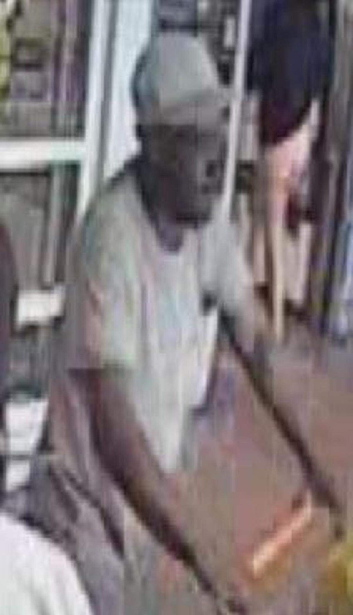 A suspect walks out of Walmart