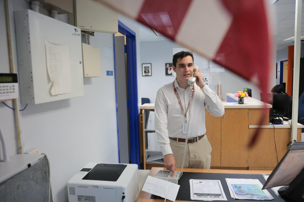 Hialeah-Miami Lakes Senior High School student Maurits Acosta holds the phone he uses to make public announcements at his school. Acosta is involved in so many civic activities and initiatives that his school created an office space for him to work.