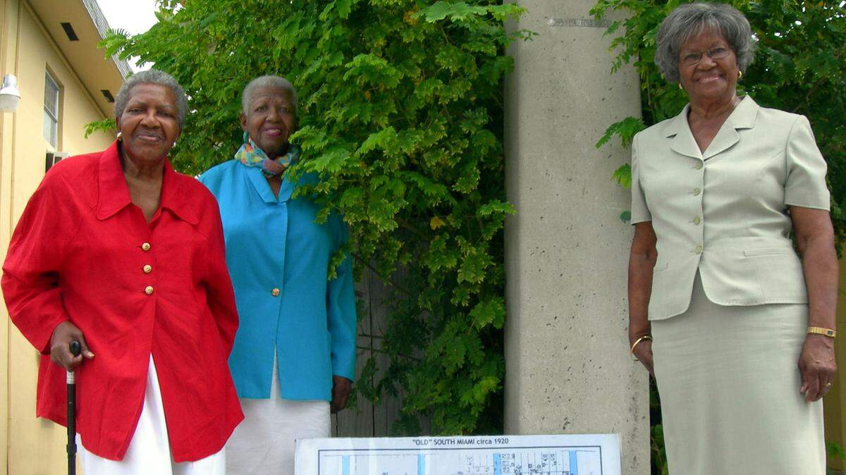 Sisters Leona Johnson Fulton, Georgiana Johnson Bethel and Edna Johnson Williams mark the spot in Little Havana where their family’s home, 615 SW 21st St. (now Southwest Ninth Street), stood in the early 1900s.
